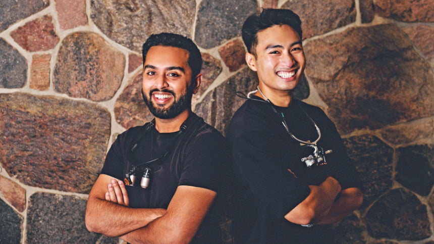 Portrait Of Two Male Dentist Staff